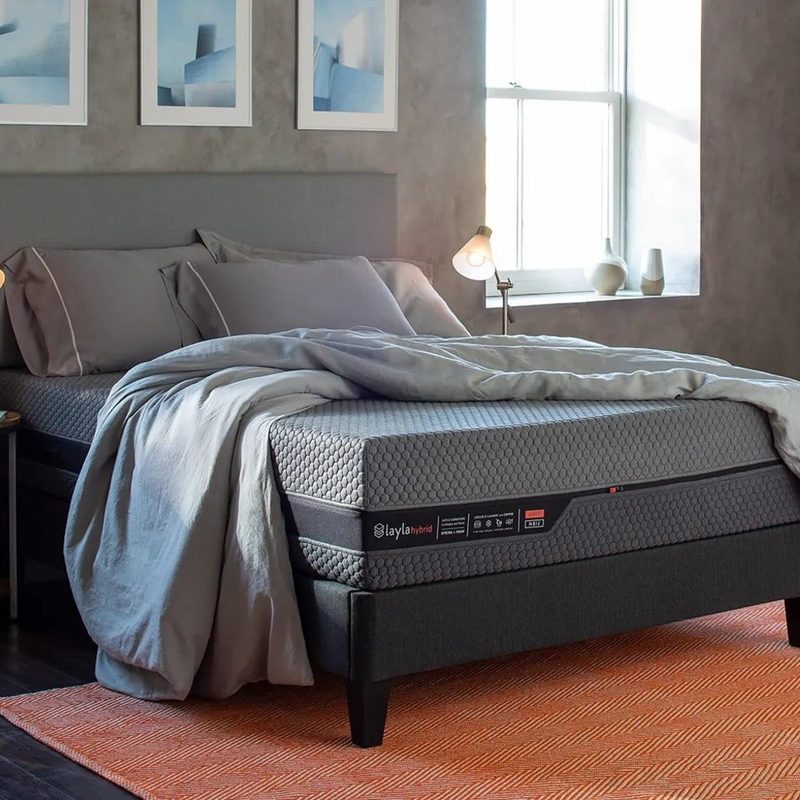 A Layla Hybrid mattress sits in a bedroom.