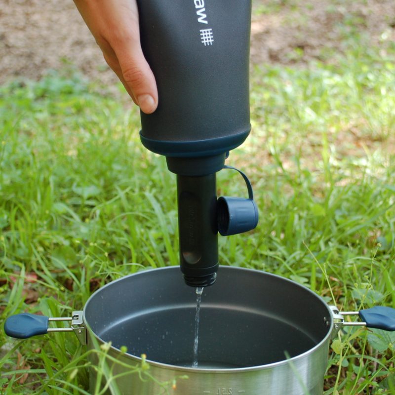 Lifestraw peak series water bottle being used to sqeeze filter water.