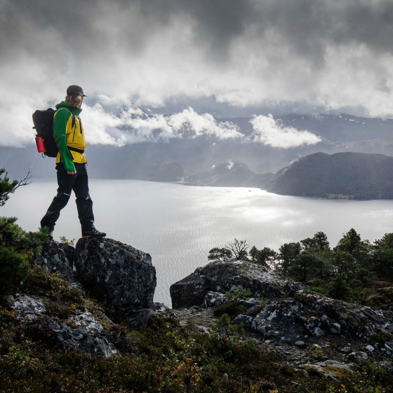 Man hiking in the mountains on a rainy day.