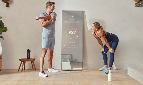 MIRROR by Lululemon in use in living room.