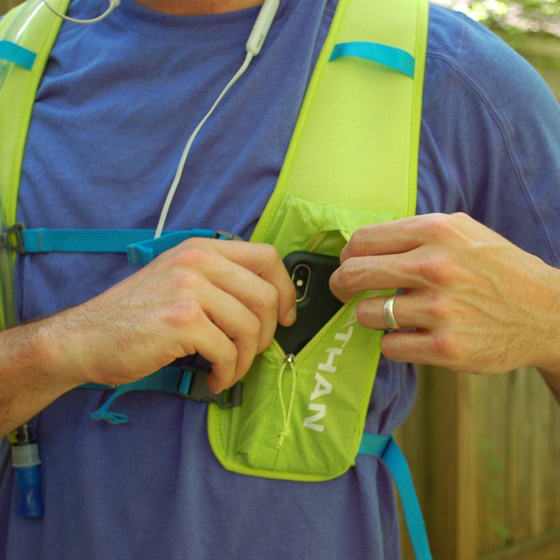 Detail on the Nathan Quickstart 2.0 zippered cell phone pocket.