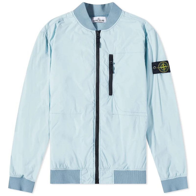 Stone Island Nylon Bomber in light blue with a blank background. 