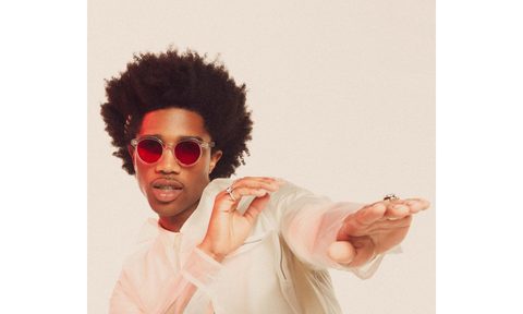 A model sporting Futuremood's Aura Boost sunglasses, developed with The Chainsmokers