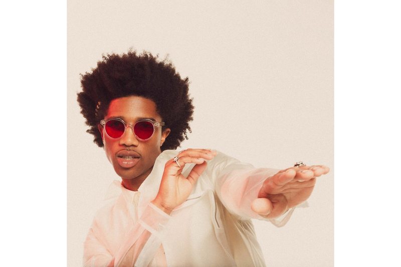 A model sporting Futuremood's Aura Boost sunglasses, developed with The Chainsmokers