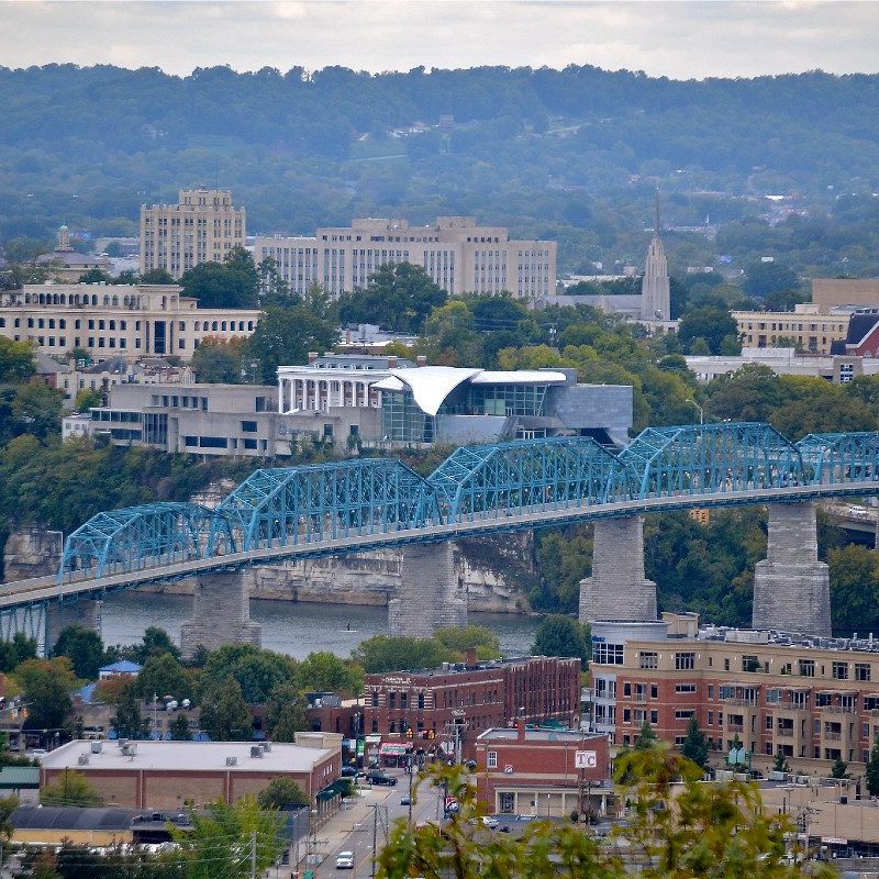 The Chattanooga, Tennessee skyline, a bridge over the Tennessee River in the foreground