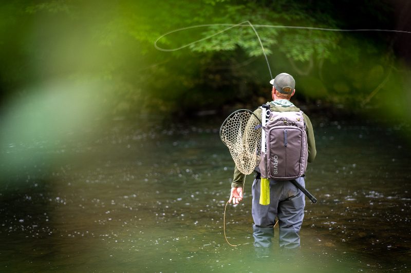 Man fly fishing at Equinox Resort.