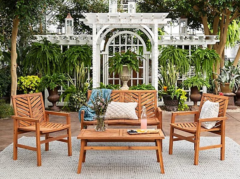 Forest Gate Olive 4-piece outdoor Acacia chat set on an outdoor garden deck.