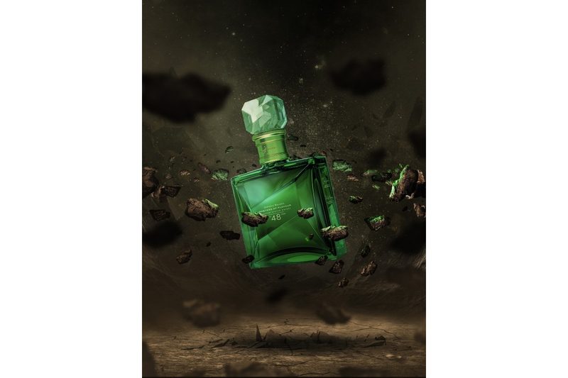 A preview of exclusive Johnnie Walker NFT work designed by BossLogic and featuring the Masters of Flavour emerald-colored bottle.