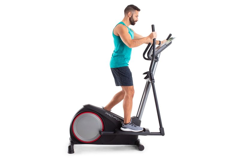 A man works out on the ProForm Sport E2.0 smart elliptical.
