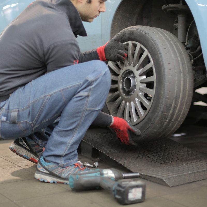 Guy working on a tire