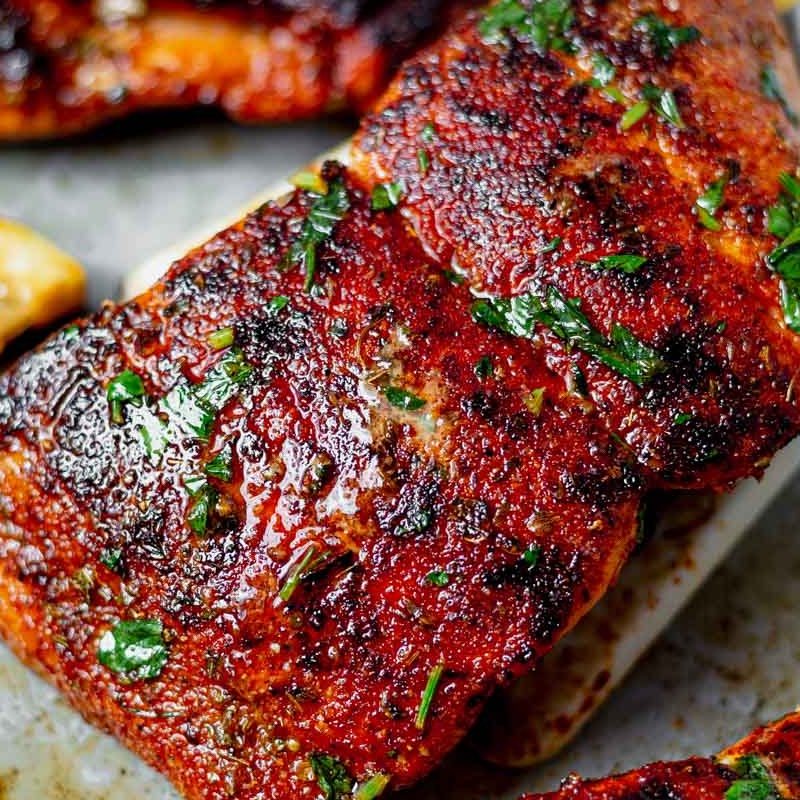 Cajun air fryer salmon with lemon on a platter