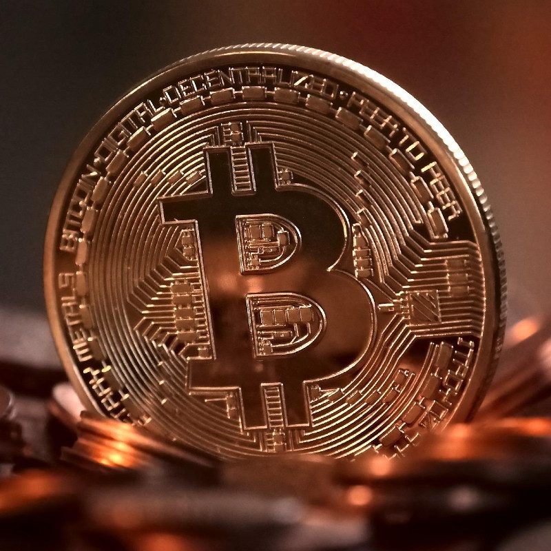 A physical, gold-colored Bitcoin.