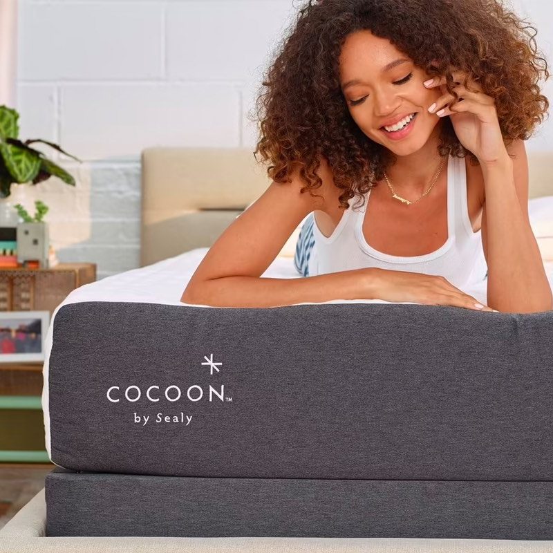 A woman rests on the Chill Mattress by Cocoon.