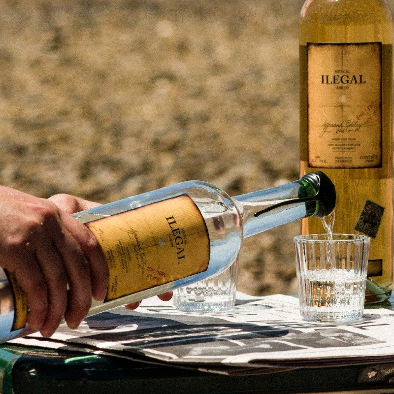 Illegal Espadín being poured into a sipping glass.