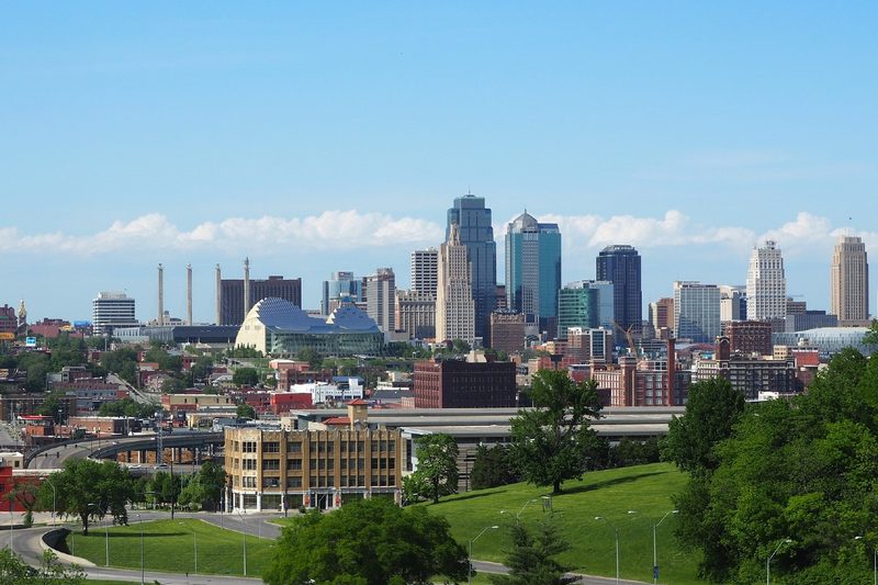 A downtown panorama of Kansas City, Missouri with a sprawling park in the foreground.