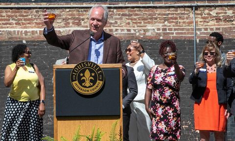 Louisville Mayor Greg Fischer toasts a glass of bourbon to Louisville's 'Bourbonism' growth.
