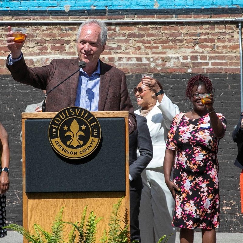 Louisville Mayor Greg Fischer toasts a glass of bourbon to Louisville's 'Bourbonism' growth.