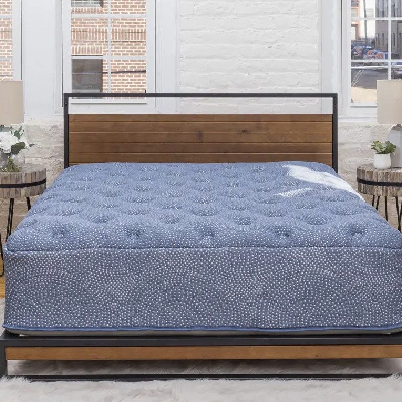luuf mattress on a wood and steel bedframe.