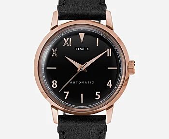 black leather timex watch on a light grey background