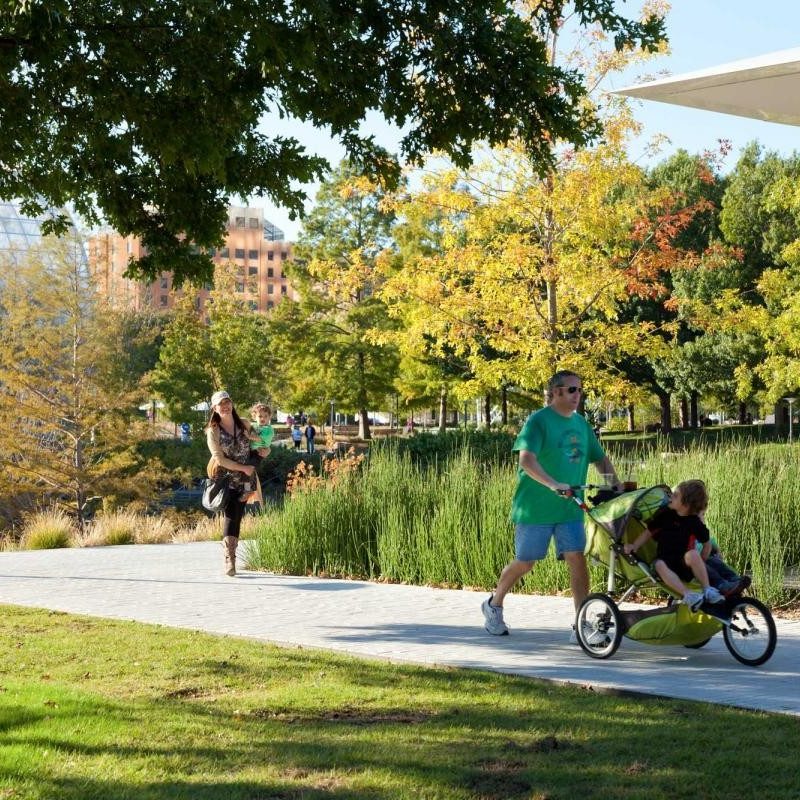 Pedestrians walking in Myriad Botanical Gardens.