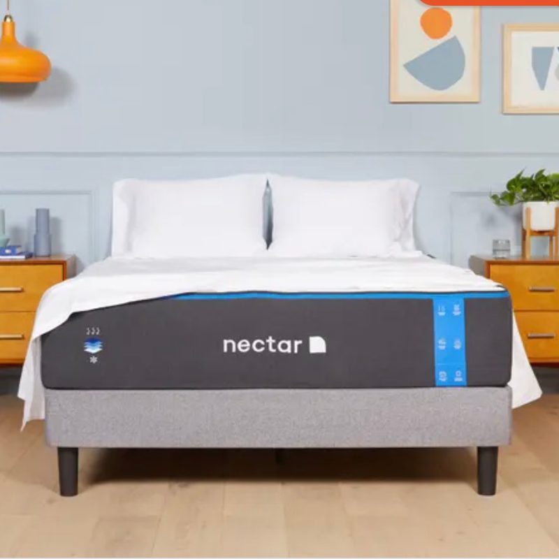 Bed made with Nectar basics in a bright bedroom