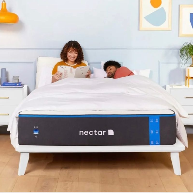 couple on a nectar mattress in a bright bedroom.