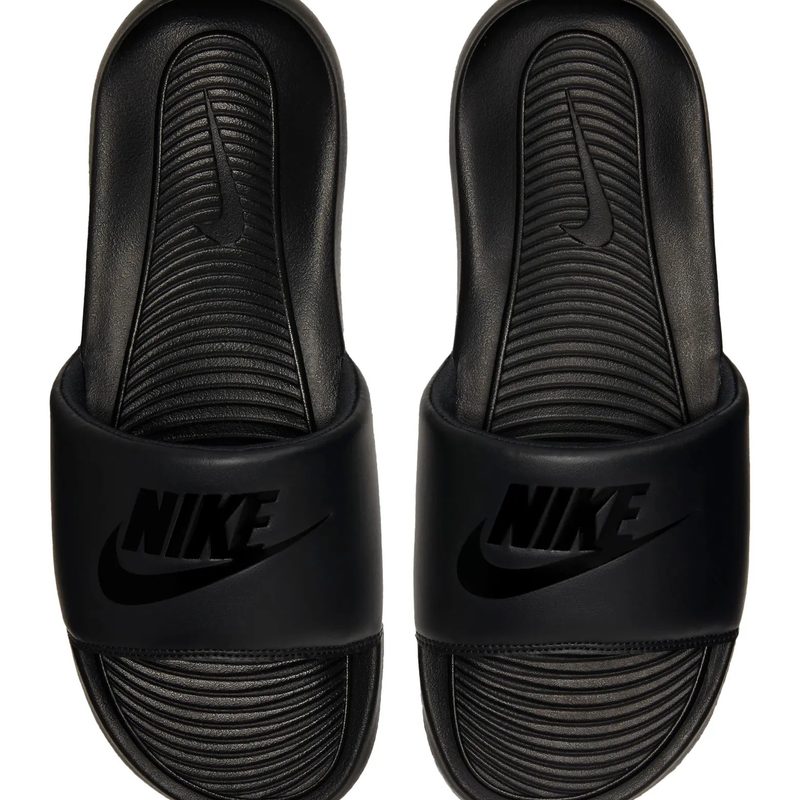 Black nike victori slides are pictured from the top down on a white background.