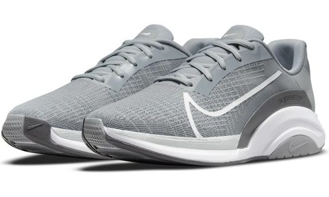 grey nike sneakers on a white background