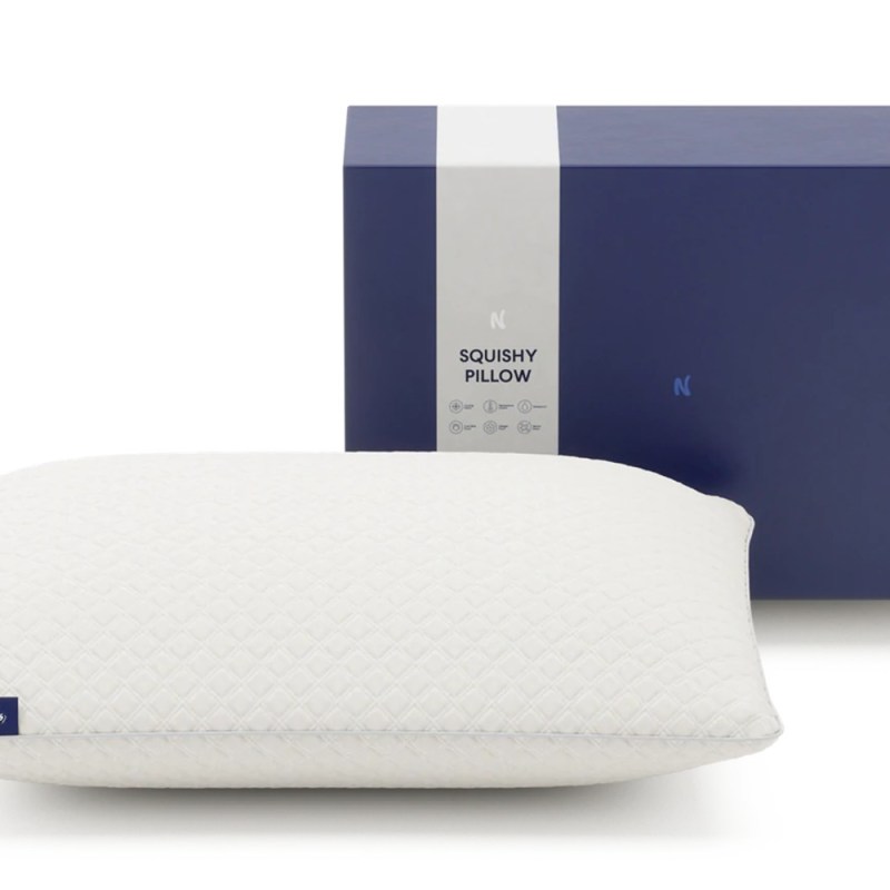 An opened Nolah Squishy Pillow box and a Nolah Squishy Pillow outside