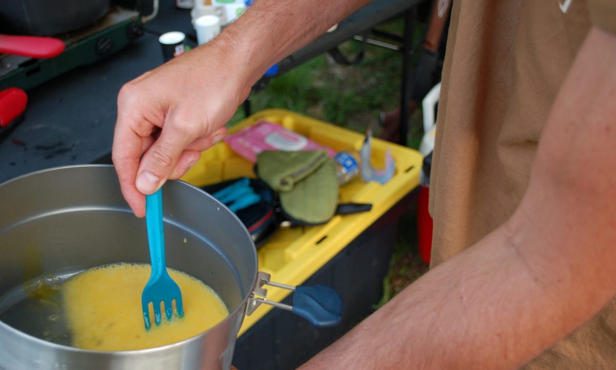 Preparing a meal with the quecha camp cookset pot.