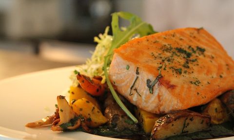 Roasted salmon with potatoes and salad