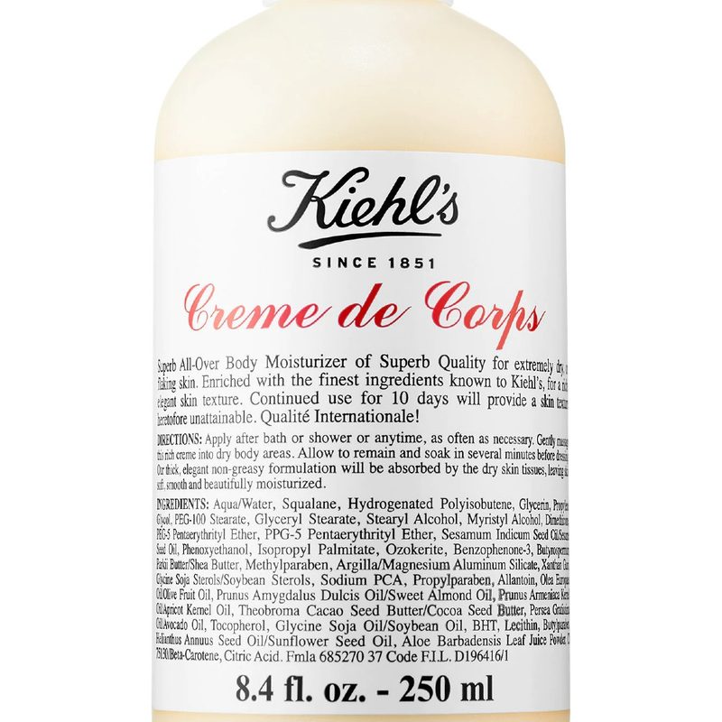 A close-up of a bottle of Kiehl's Crème de Corps Hydrating Body Lotion with Squalane.