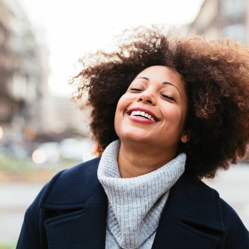 A model smiles at Shine app's benefits.