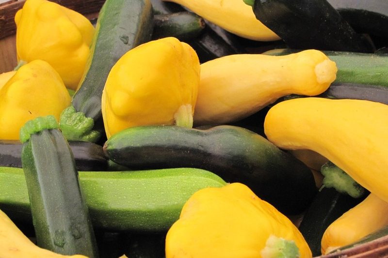 several varieties of summer squash in a bowl