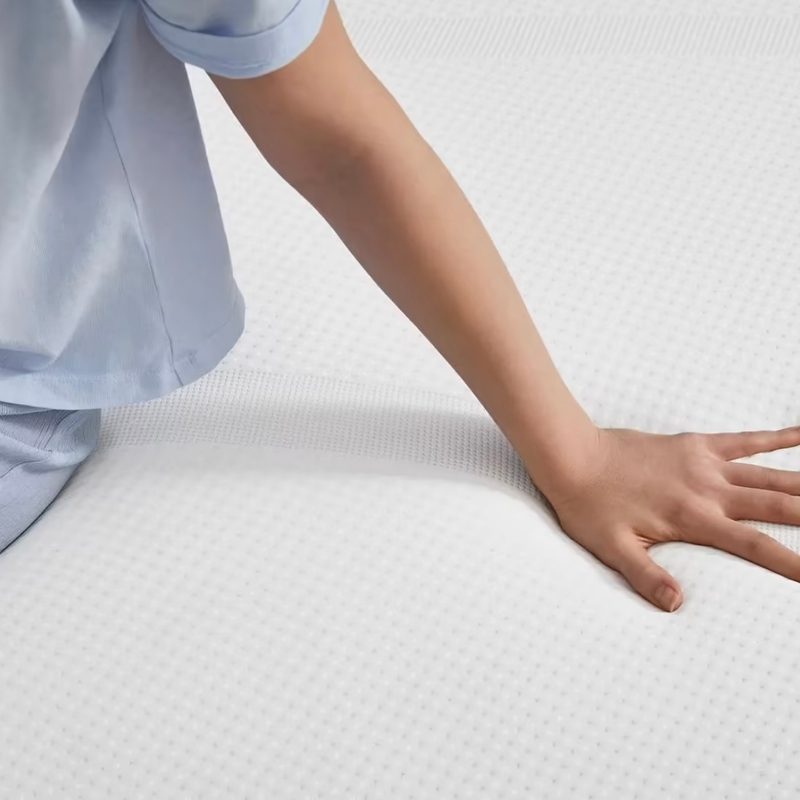 Model on Tempur-Pedic mattress