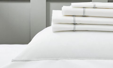 the white company white luxury bedding displayed on a mattress
