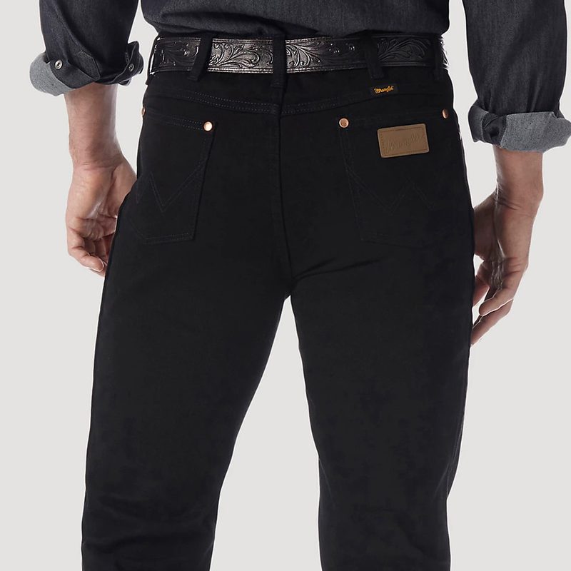 Back pocket details of Wrangler Cowboy cut jeans in black.