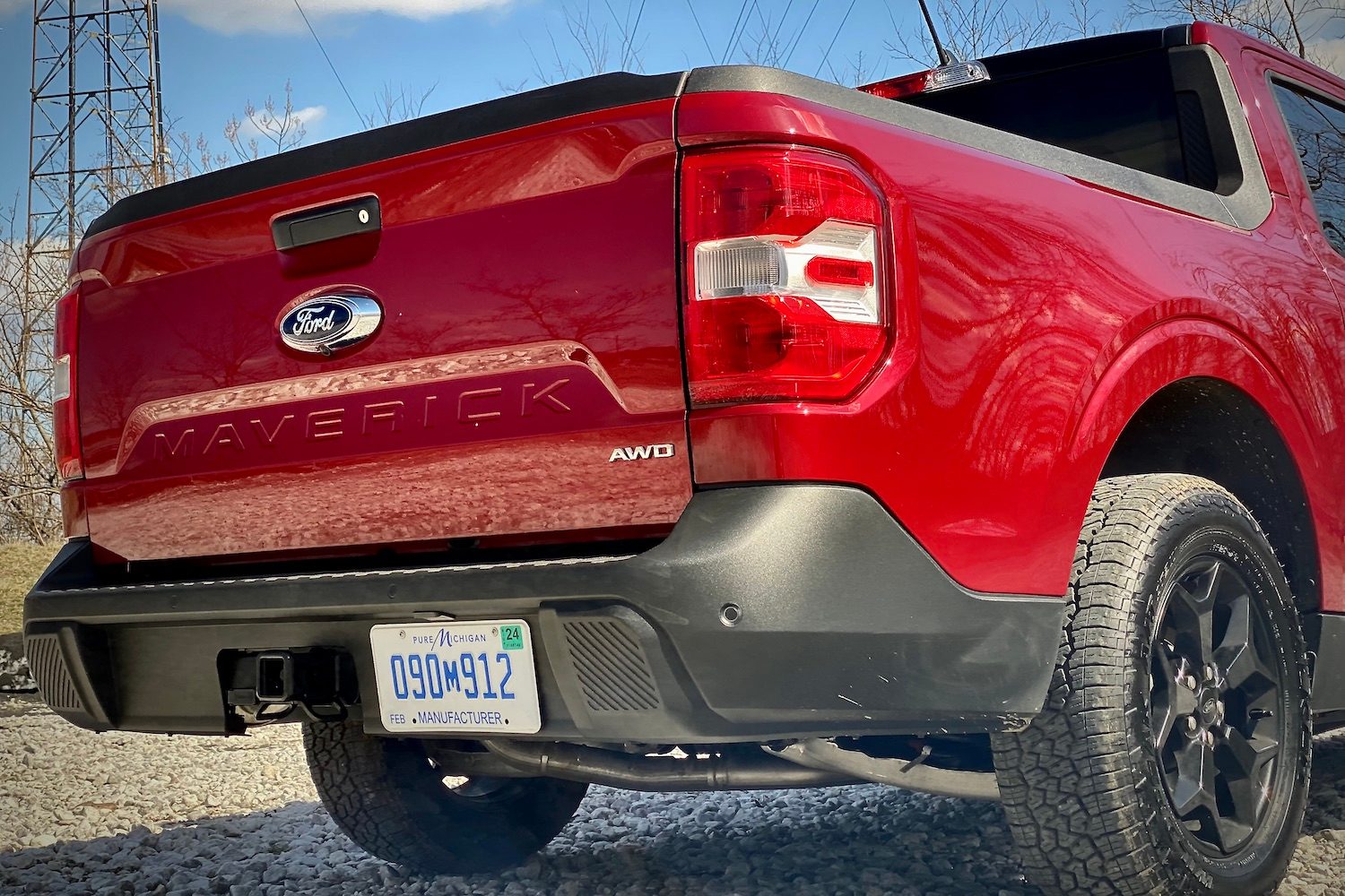 Close up of 2022 Ford Maverick rear end tailgate from passenger side with blue skies in the back.