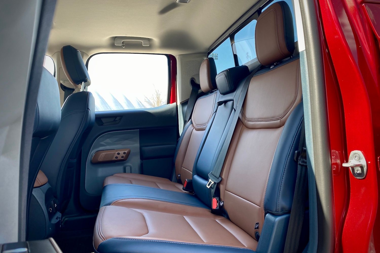 Rear seats in 2022 Ford Maverick from side profile outside of the truck.