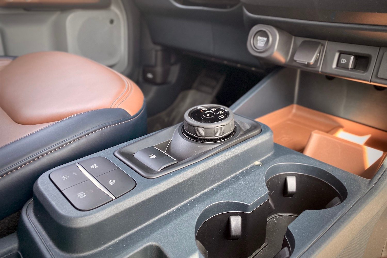Close up of 2022 Ford Maverick shifter and buttons in center console.