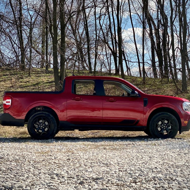 Side profile of 2022 Ford Maverick in a gravel parking lot