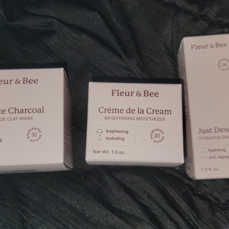 A collection of Fleur & Bee's clay mask, serum, and moisturizing cream