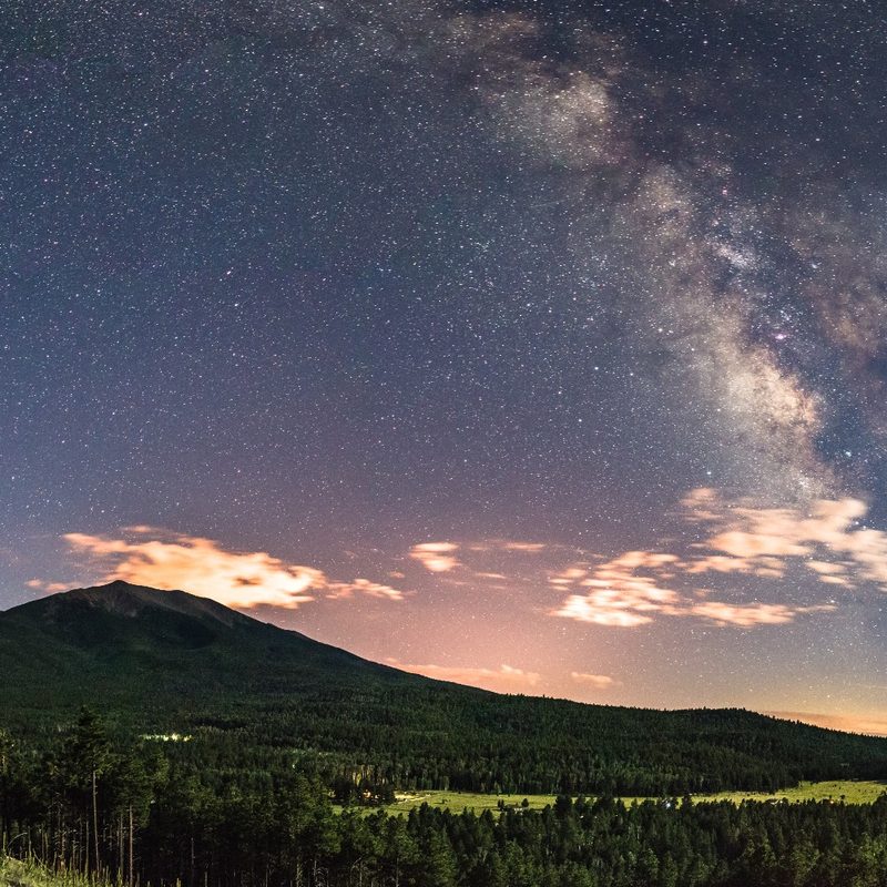 Nighttime view of the San Francisco Peaks from the northwest on the rim of Walker Lake crater, located north of the junction of Hart Prairie Road and FR 418. Humphreys Peak, the highest point in Arizona at 12, 633 feet in elevation, is the foremost peak in view.