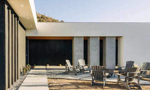 A desert patio and patio chairs inside The Old Man safe house