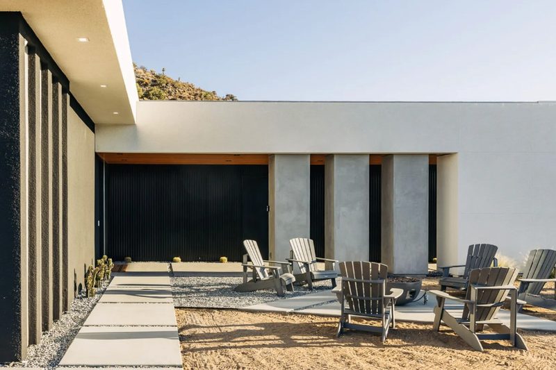 A desert patio and patio chairs inside The Old Man safe house