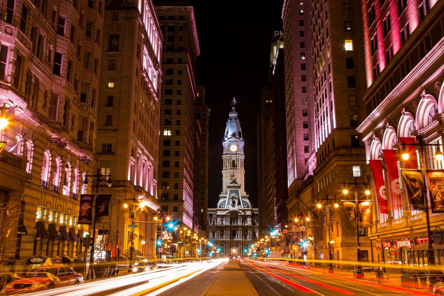 A nighttime view of Philadelphia City Hall, as seen looking north from Broad Street between Walnut and Locust Streets. Philadelphia, Pennsylvania, USA.