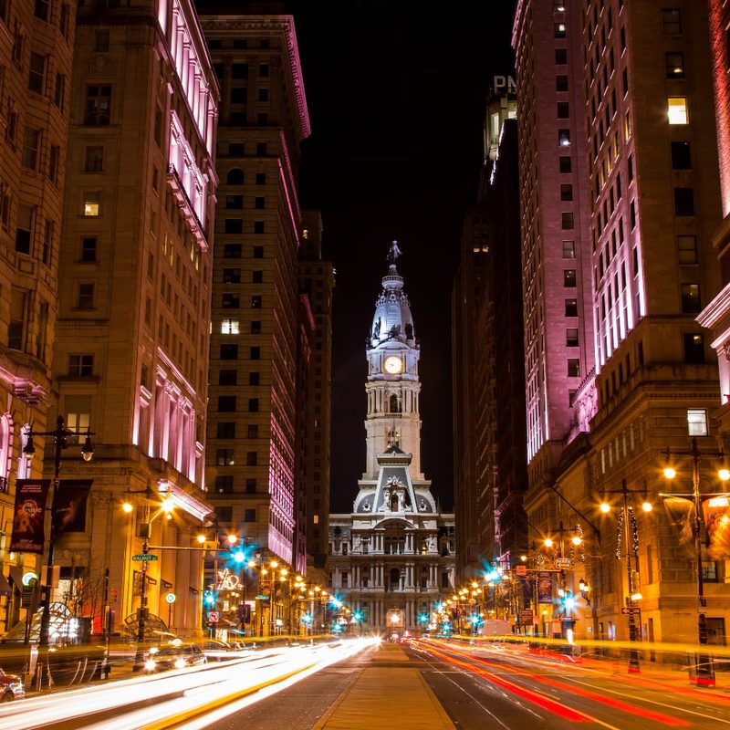 A nighttime view of Philadelphia City Hall, as seen looking north from Broad Street between Walnut and Locust Streets. Philadelphia, Pennsylvania