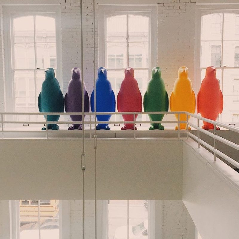 Colored penguins aligned on a balcony represent some the 21C Hotels' artworks.