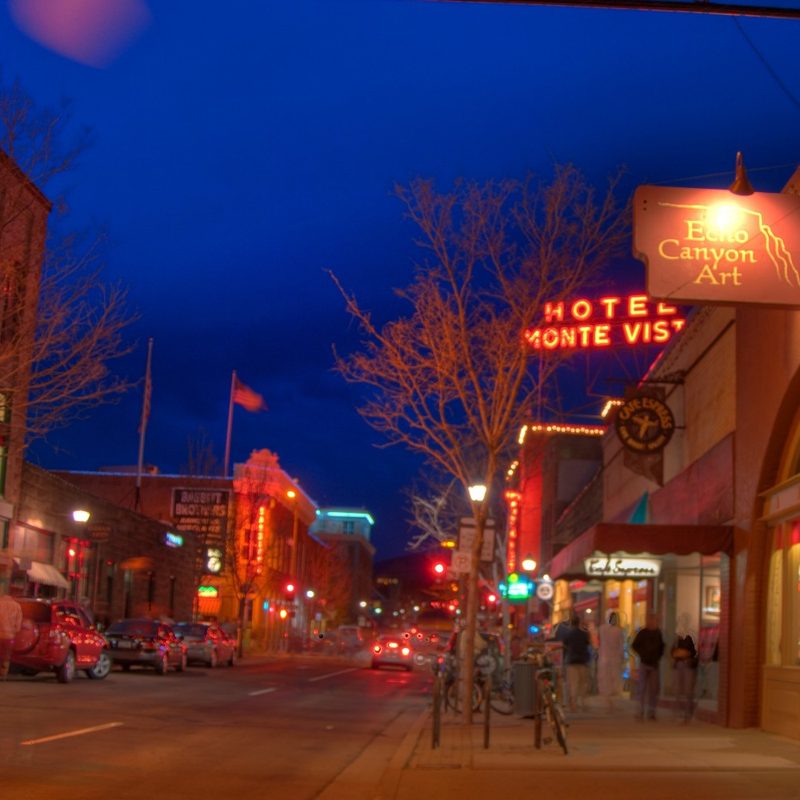 An image of some downtown Flagstaff buildings, including the Hotel Monte Vista, with artistic light