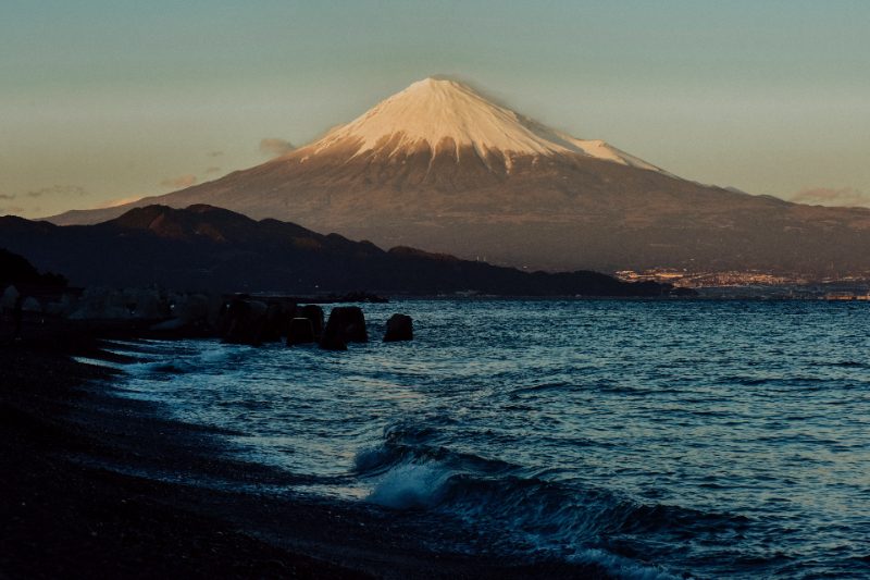 Dark sands and ocean water of Miho Beach in Shimizu, Japan.